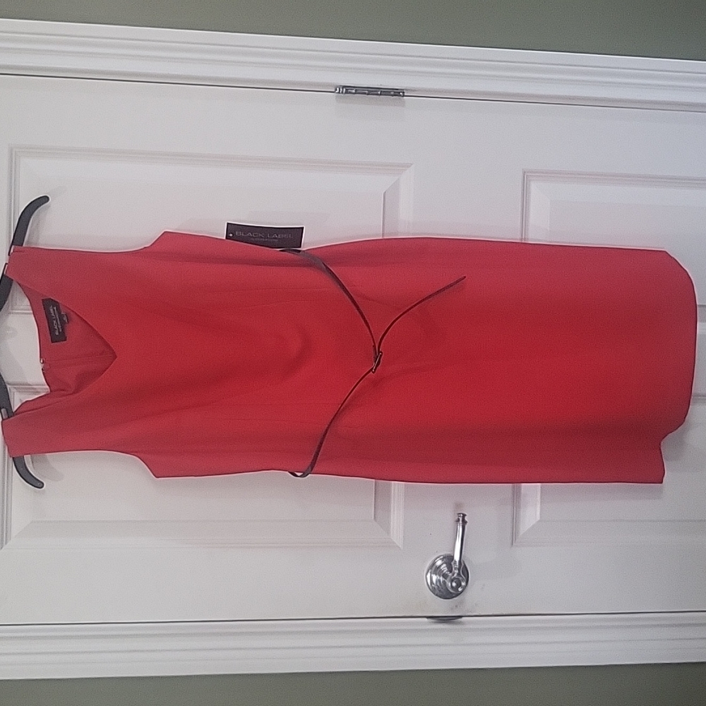 Red dress with black belt and short split in back